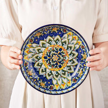 Ceramic pasta bowl with bold blue floral medallion design and scalloped rim border