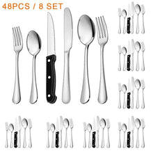 Stainless steel flatware set for 8: forks, spoons, and knives with black handles