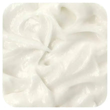 Thick white hair masque cream, swirled in a close-up