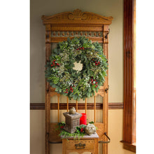 Evergreen wreath with red berries and layered green foliage