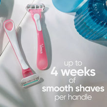 Set of Venus disposable razors with pink handles and silver triple blades