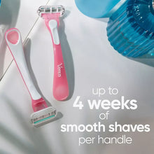 Disposable razors with pink handles and white cartridges, shown side by side.