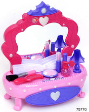 Child vanity table with mirror, light-up bottles, and pretend makeup tools