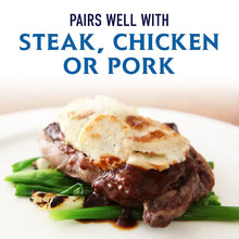 Sauce serving suggestion: cooked meat with sauce and sliced vegetables on a plate