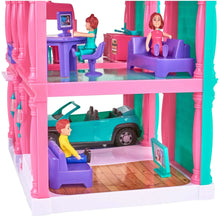 Pink dollhouse interior with teal car, purple seats, and two doll figures