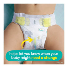 Baby diaper on child’s hips, white with light patterns and Pampers label.