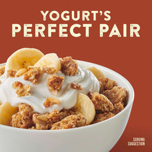 Cinnamon granola over yogurt in a bowl with banana slices