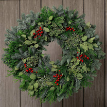 Seasonal evergreen wreath with eucalyptus leaves and red berry clusters