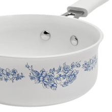 White ceramic pot with blue floral print and riveted side handles