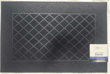 Flexible rubber doormat with raised crisscross grid tread and textured surface, dark gray.