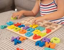 Wooden alphabet puzzle with a child arranging colorful letter blocks on the board