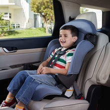 Kids booster car seat in car with child reclining, dark blue headrest and light gray seat