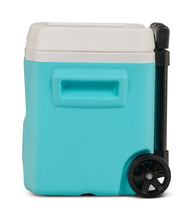Aqua hard-sided cooler with white lid and telescoping handle, front-right angle