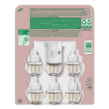 Air Wick package back showing one plug-in warmer and six scented oil refills