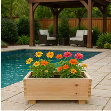 Cedar rectangle planter with colorful flowers on patio near a swimming pool.