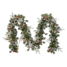 Decorated Christmas garland with green pine, red berries, pinecones, and small ornaments
