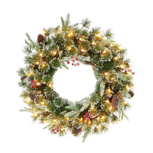 Lighted Christmas garland wreath with green pine, pinecones, red berries, and warm bulbs