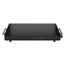 Electric warming tray with black top surface and side handles