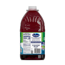 Juice drink bottle back label with nutrition facts, barcode, and red liquid.