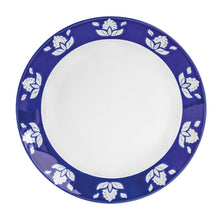Indigo blue round dinner plate with white floral motif around the outer rim
