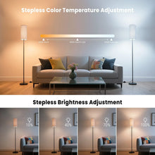 Black LED floor lamp with two-tone fabric shade and adjustable brightness glow