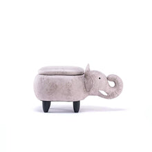 Gray plush elephant ottoman with side trunk and large ear, padded top, dark legs