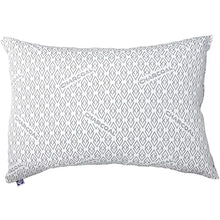 Geometric pattern pillow with dark logo text and blue tag at corner