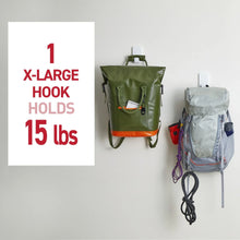 White X-Large hook holding a green tote bag on a wall