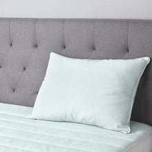 Light blue square pillow with smooth cover and visible stitched seams