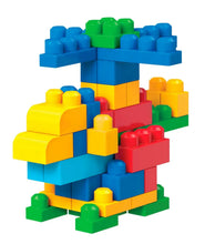 Colorful plastic block house shape with blue roof, yellow base, and red and green details