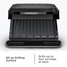 George Foreman nonstick grill with ribbed cooking plates and closed lid