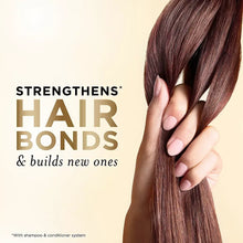 Pantene Daily Moisture Renewal hair care ad with a hand holding long dark hair