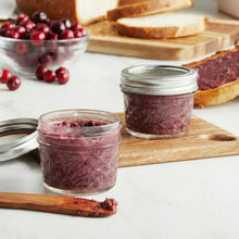 Mini quilted mason jars with burgundy jam, clear glass and silver metal lids