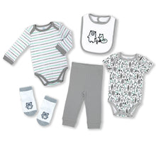 Baby layette gift set clothing: striped bodysuit, gray pants, patterned romper, socks, bib