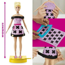 Fashion doll on stand wearing purple dress with black heart trim