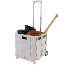 White collapsible utility cart with extended handle, carrying stacked balls and gear