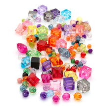 Multicolor acrylic bead pile with square and faceted cube shapes