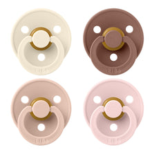 Four BIBS baby pacifiers in cream, brown, and two shades of pink