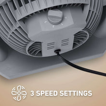 Gray air circulator fan underside with speed dial and connected power cord.