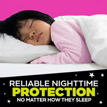 Girls pink bedtime pajama set while lying on bed