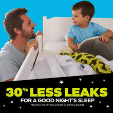 Boys nighttime bedwetting underwear with dark dinosaur print waistband, worn under blue pajamas