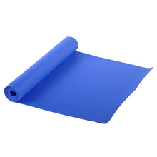 Rolled blue PVC yoga mat with textured, non-slip surface