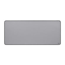 Mid-grey desk mat with rounded corners and stitched edge, Logitech logo at bottom right