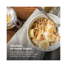 Ninja pressure cooker at-home yogurt in a white bowl with banana slices and granola