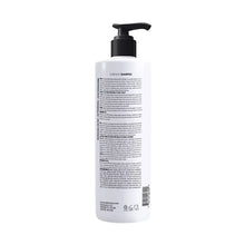 Damanci clarifying shampoo bottle with pump, back label panel visible, 32 oz.