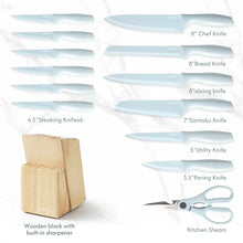 Ceramic kitchen knife set display with wooden block, scissors, and knives