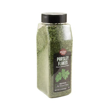 Jar of parsley flakes with label facing front and green flakes inside