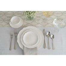 White porcelain bread & butter plates with embossed scalloped rims, on table setting