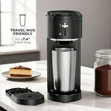 Black drip coffee maker with stainless travel mug and open brew basket
