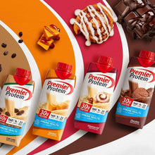 Assorted Premier Protein protein shake cartons with red caps on a colorful background